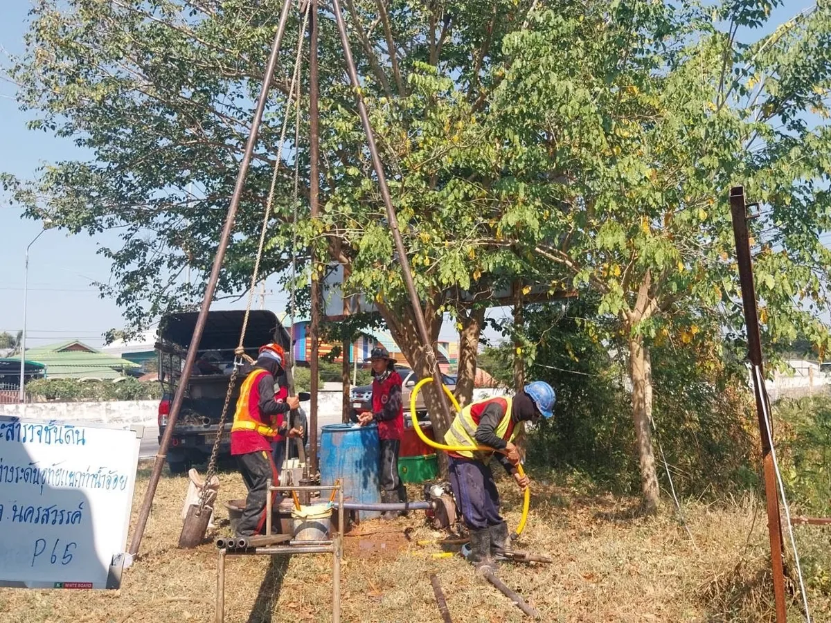 Soil boring team working near an existing facility